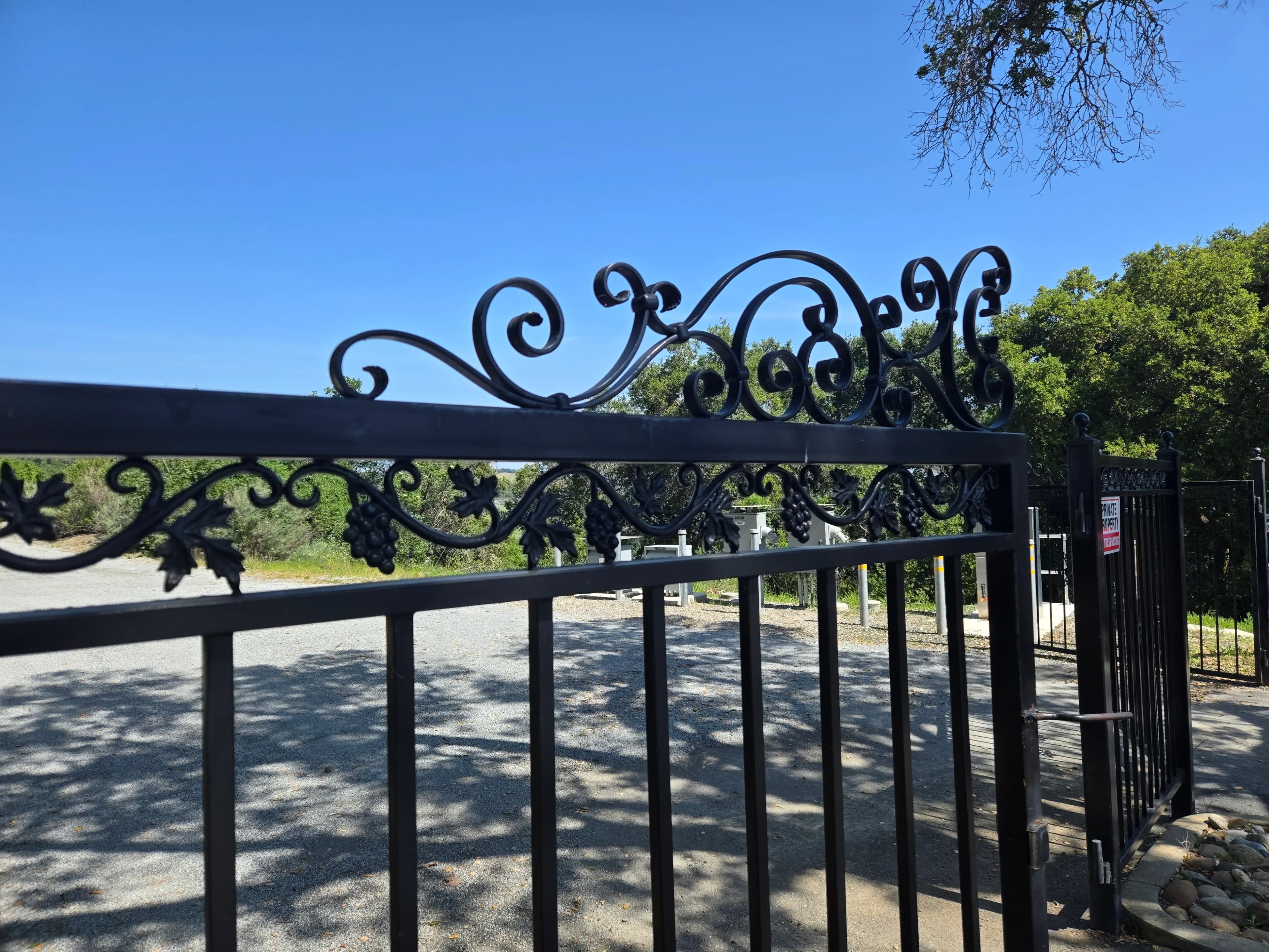 Decorative iron automatic gate with scrollwork by SF Bay Automatic Gates